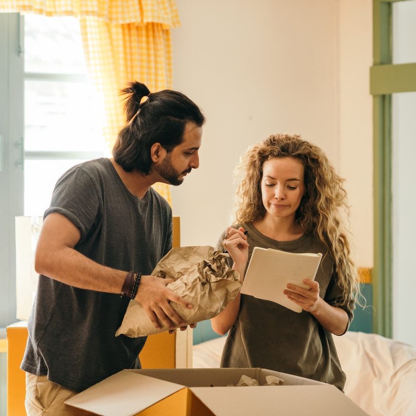 the girl and the guy pack the box