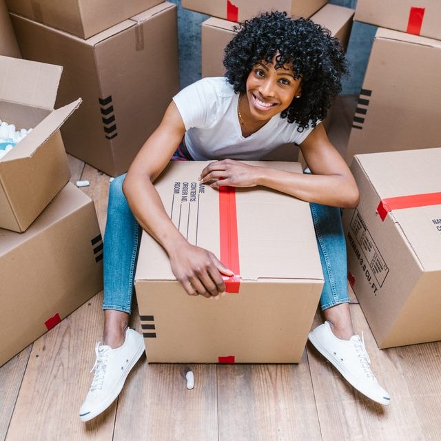 girl packing a box