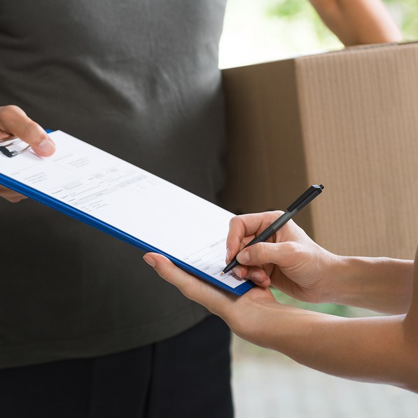 Woman signing receipt