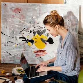 artist with laptop