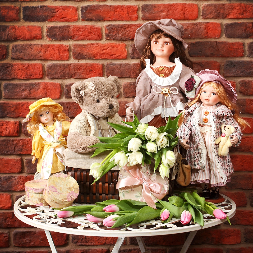 porcelain doll with teddy bear